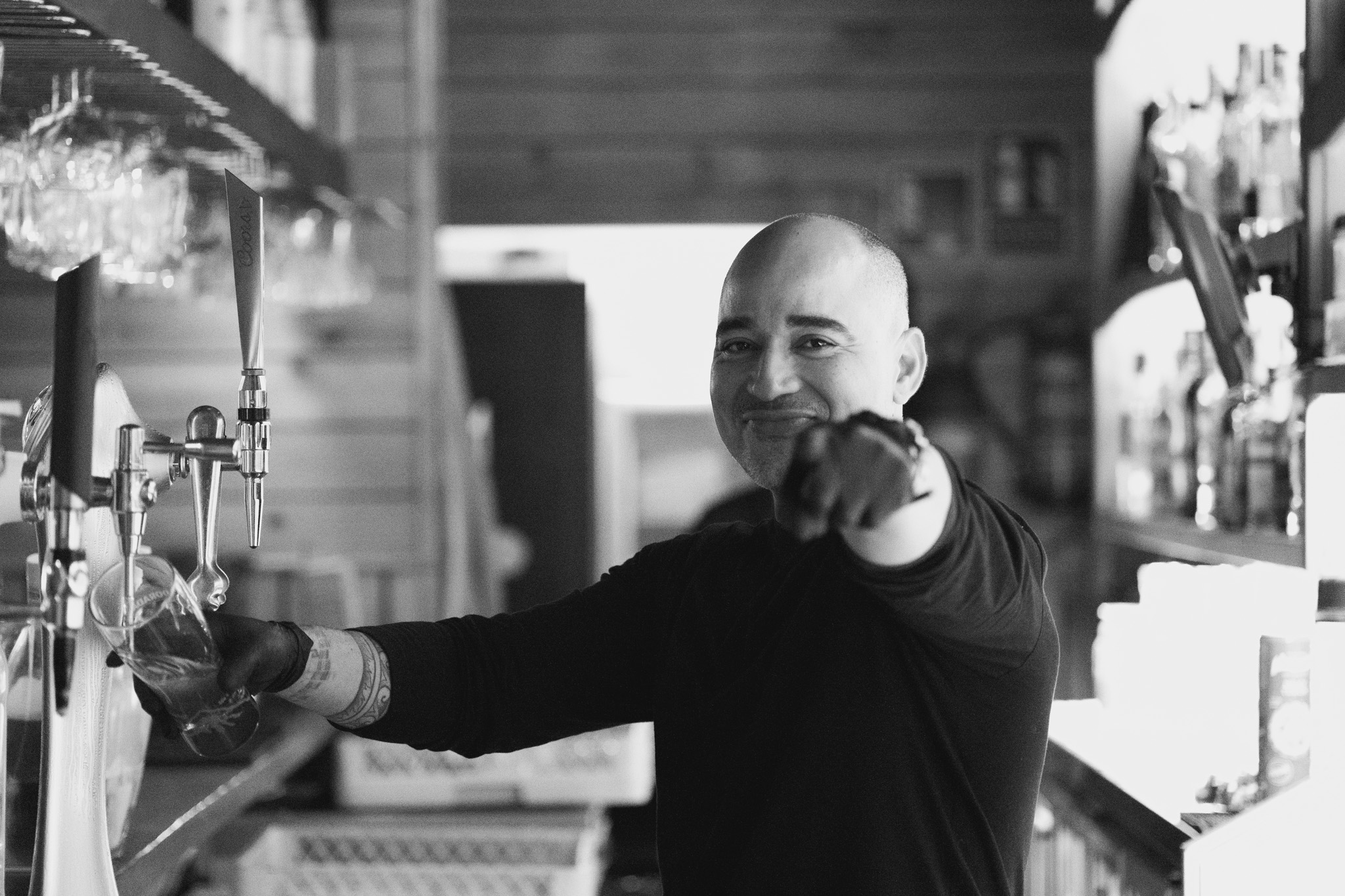 Bartender smiling behind the bar at Kings Lanzarote